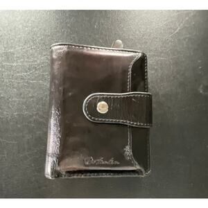Bostonian Black Patent Leather Women's Bifold Wallet With Snap Closure.